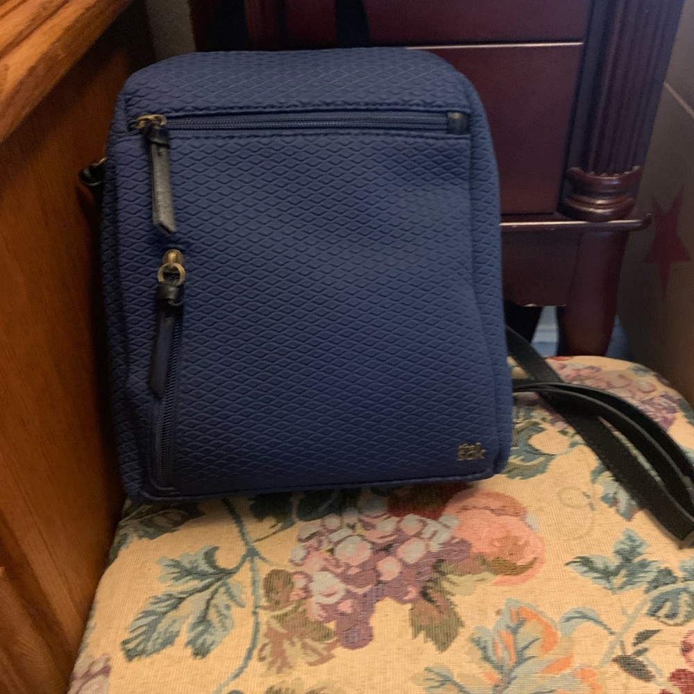 The Sak Navy blue and black straps backpack